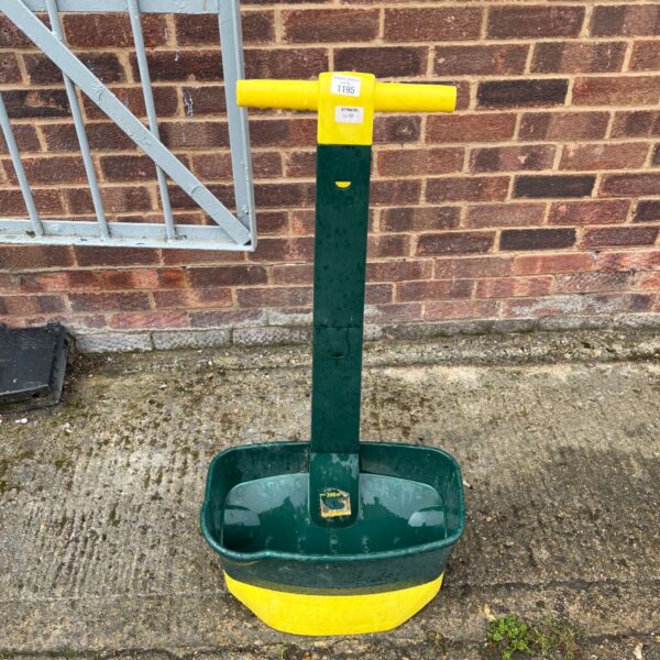 Green Evergreen lawn spreader model 1195 for garden use.