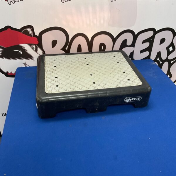Blue five exercise step platform for fitness workouts.