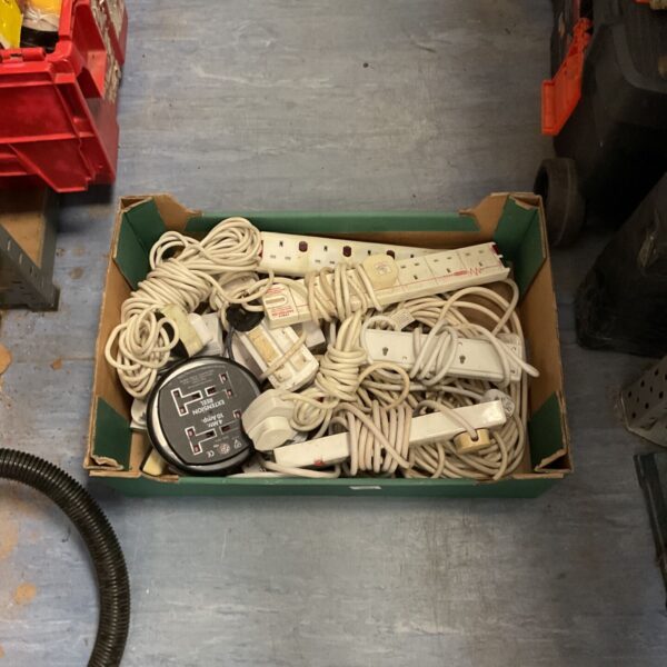 Mixed lot of used extension cables and power leads.