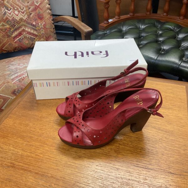 Faith red wedge sandals size 5 with decorative cutouts.