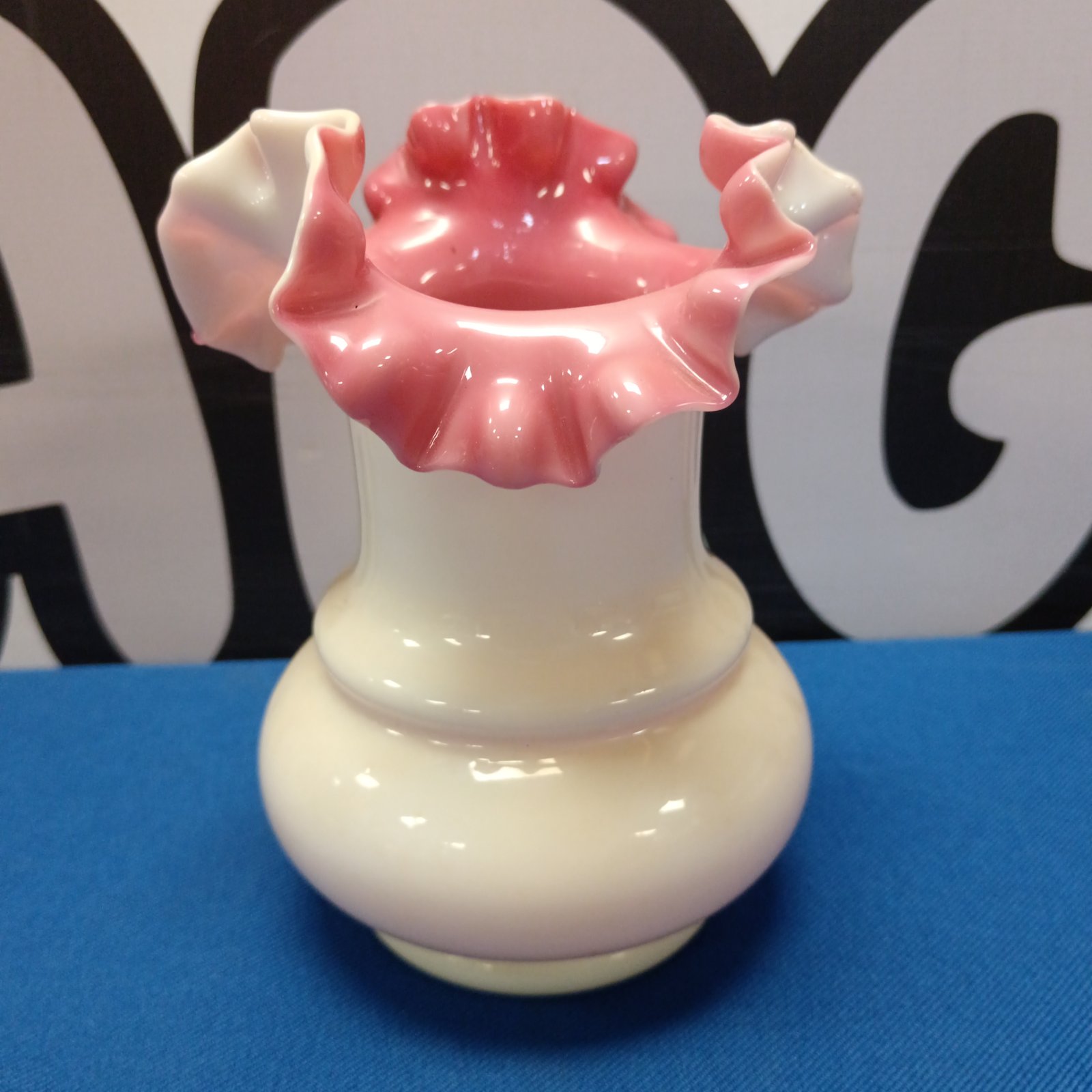 Vintage Fenton Art Glass vase with cranberry and peach colours.