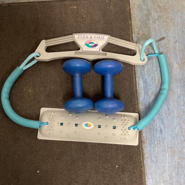 Vintage Flex and Firm exercise machine with blue weights.