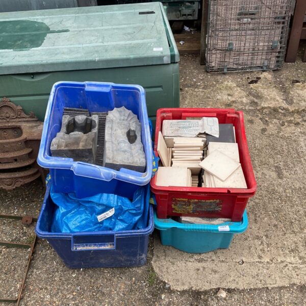 Four boxes of vintage floor tiles ready for a renovation project.