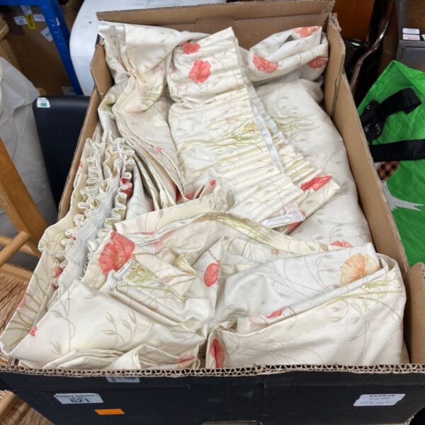 Vintage floral curtains with a red and green pattern.