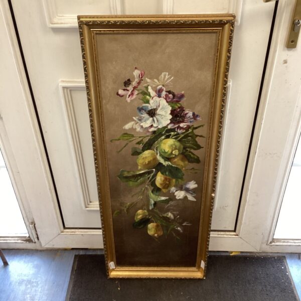 Antique floral still life painting in a decorative gilt frame.