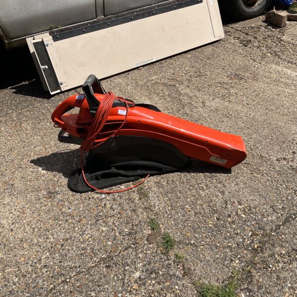 Orange Flymo lawn vac and blower in used condition.