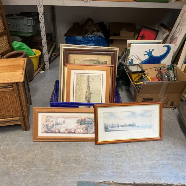 Collection of vintage framed artworks for home decor.