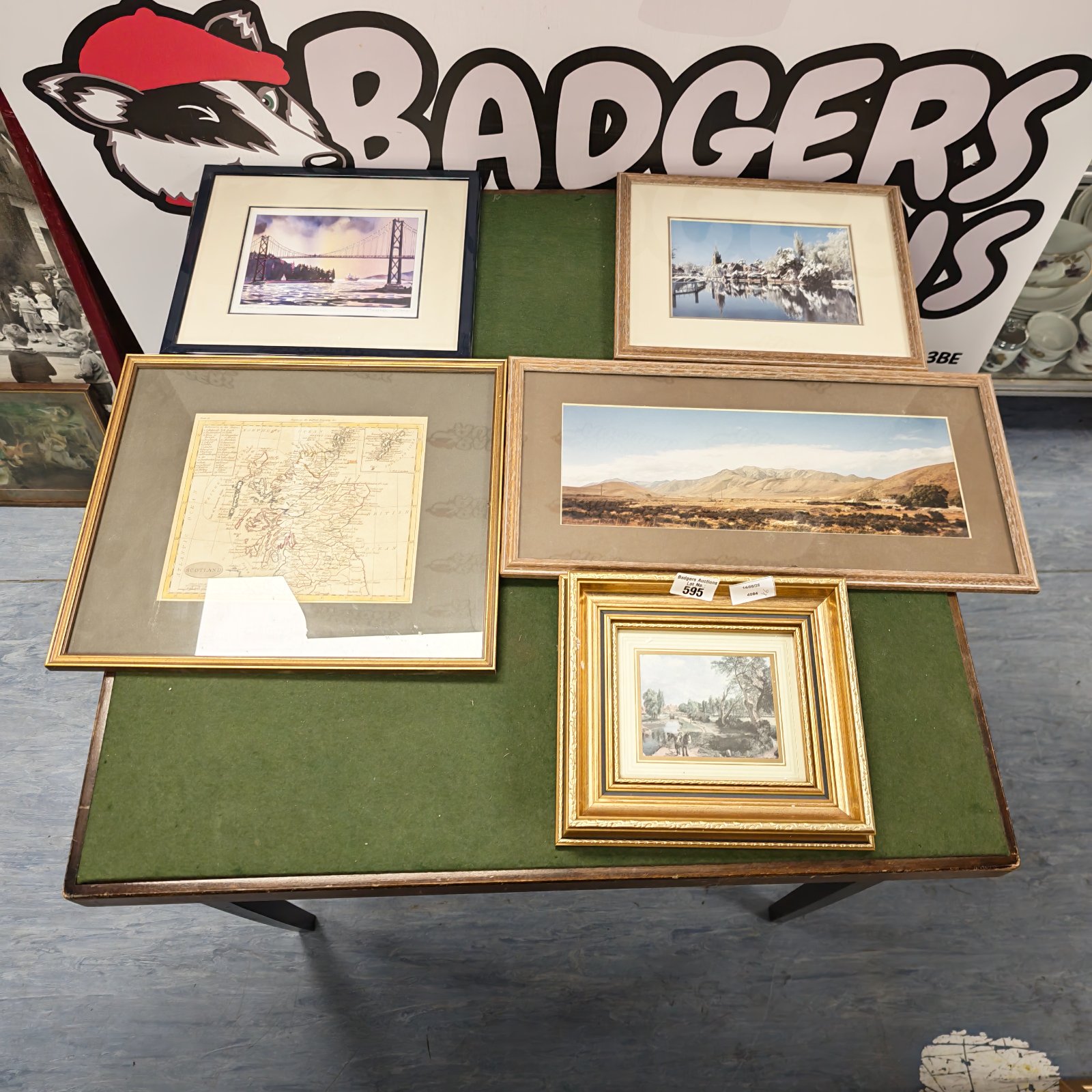 Collection of five framed prints and photographs for wall decor.