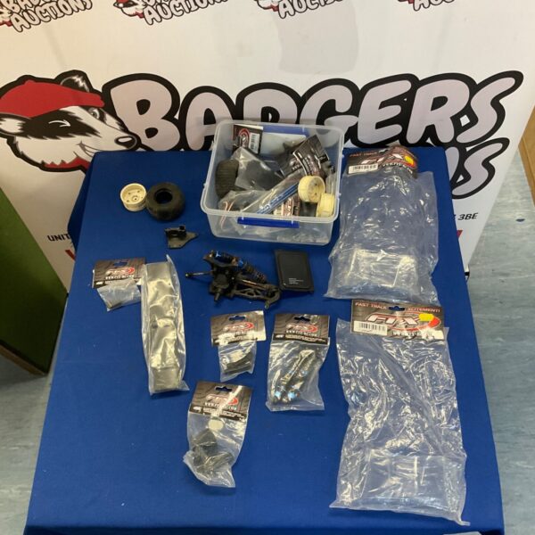 FTX RC car spare parts lot for hobbyists and repairs.