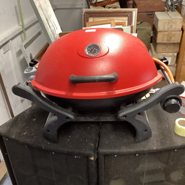 Red Fu lying hao portable gas barbecue grill for outdoor cooking.