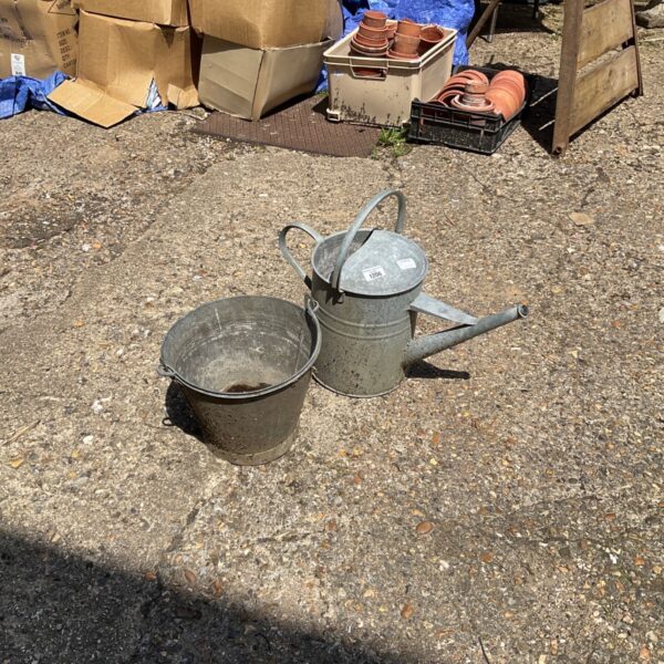 Vintage galvanised watering can and bucket for garden use.