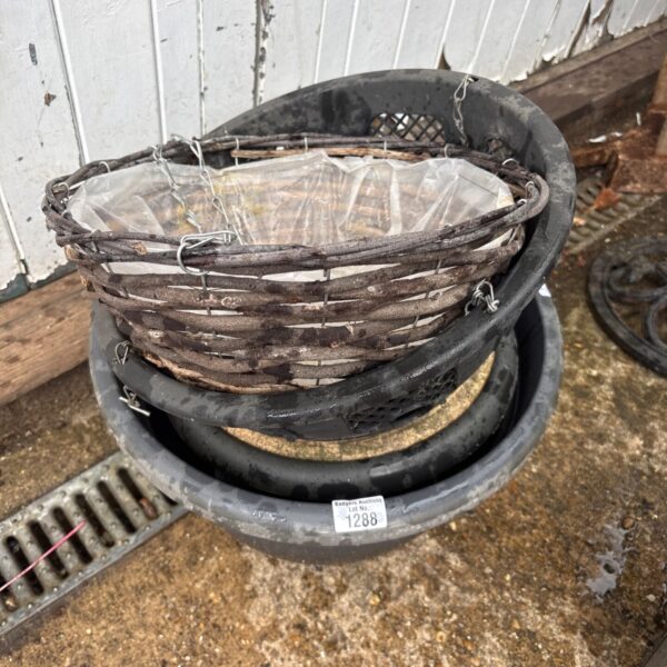 Stacked vintage wicker garden baskets for plants and storage.
