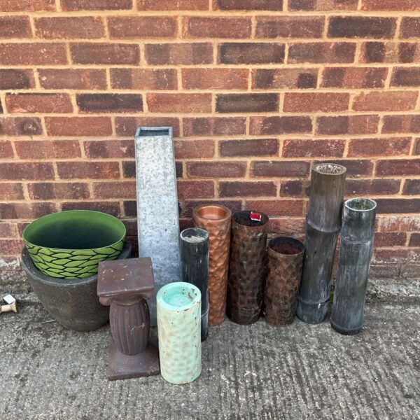 Bundle of vintage garden pots and planters for outdoor use.