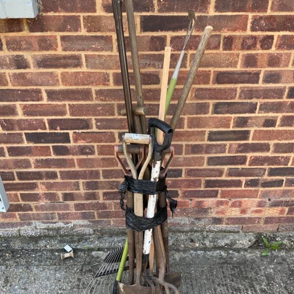 Job lot of vintage garden tools including spades and forks.