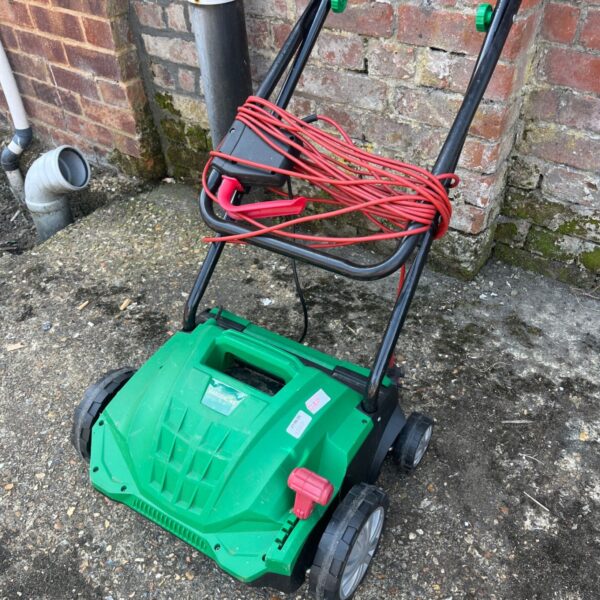 Gardenline EM700 electric lawn scarifier for lawn maintenance.