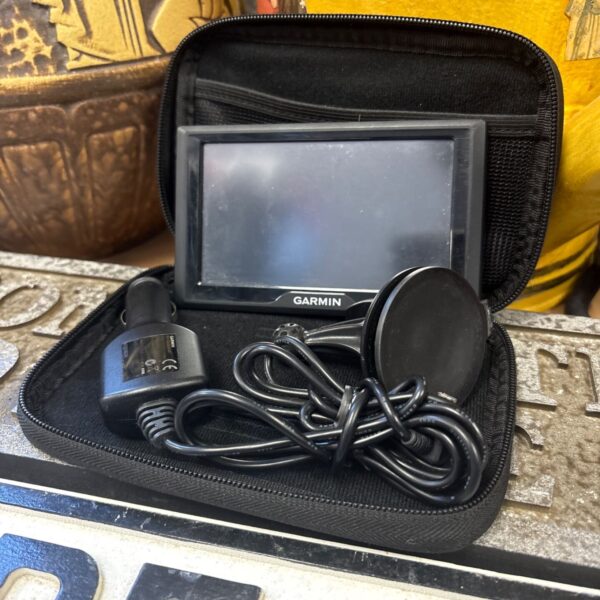 Garmin sat nav with black case and power cable displayed.