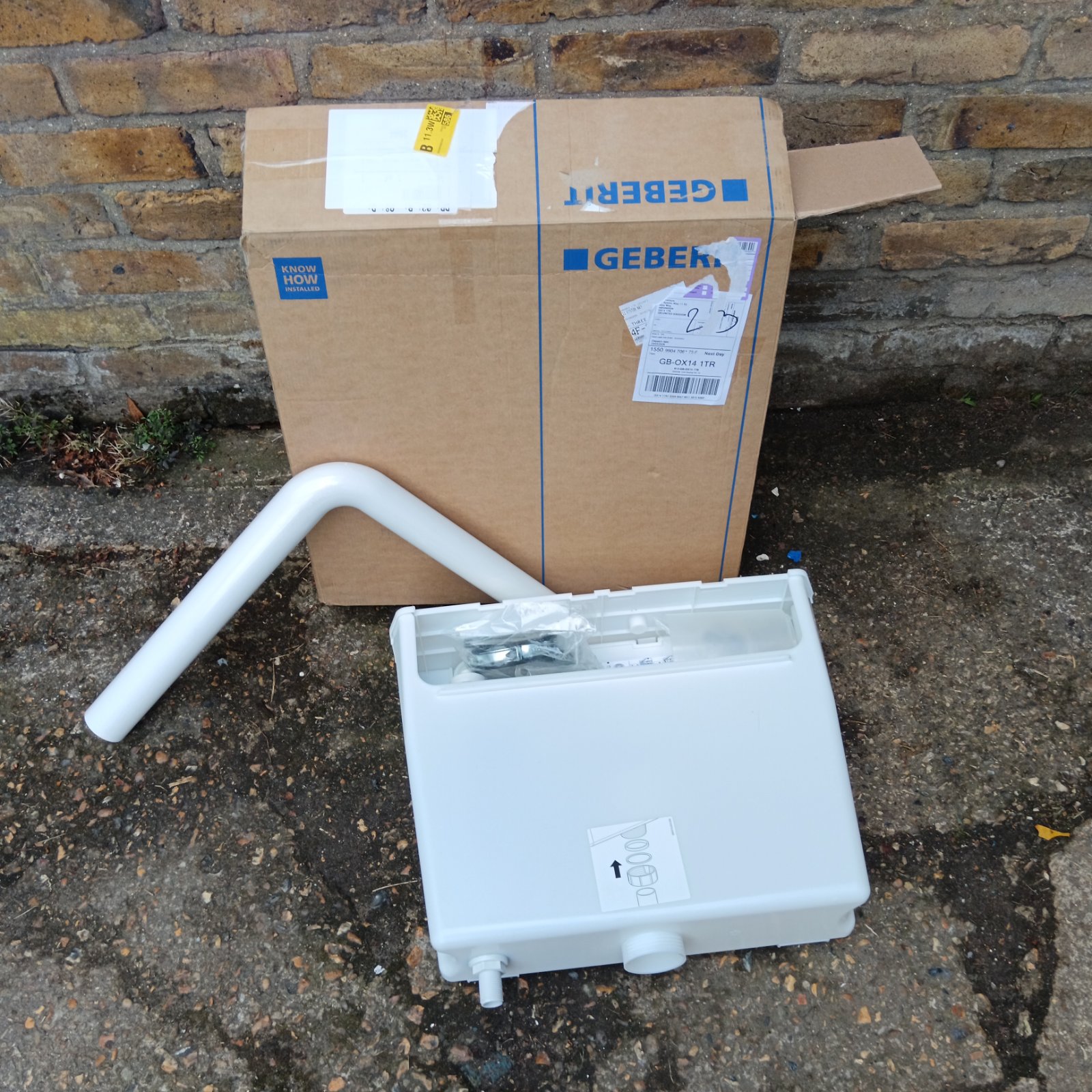 Geberit concealed cistern with packaging, ready for installation.