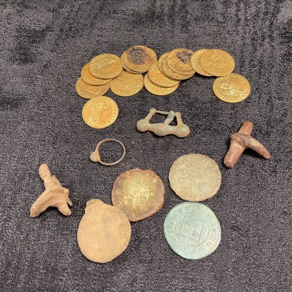 Collection of antique George III gaming tokens and metal detecting finds.
