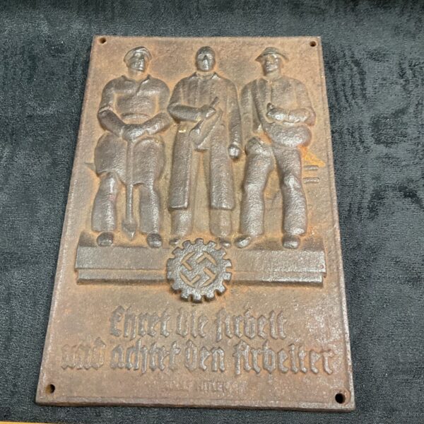 WWII German cast iron plaque depicting workers and text.
