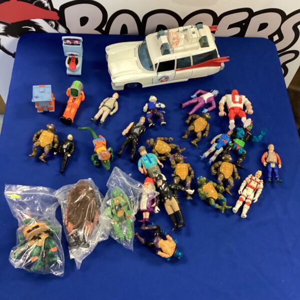 Vintage Ghostbusters and Teenage Mutant Ninja Turtles toy lot with Ecto-1.
