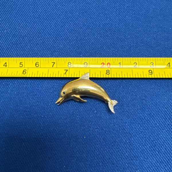 Vintage gold tone and diamanté dolphin brooch for sale.