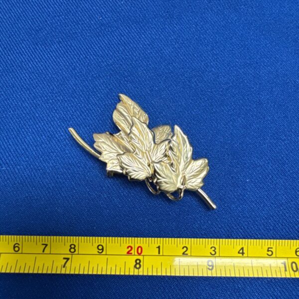 Vintage gold tone leaf brooch in original box.
