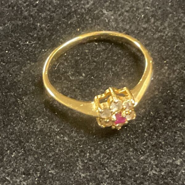 Gold plated ring with red and white stones, size P.