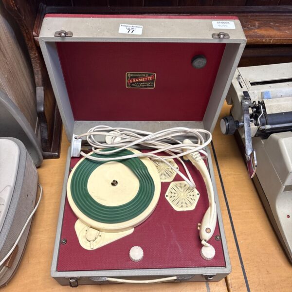 Vintage Gramette Broadcaster record player in red and cream.