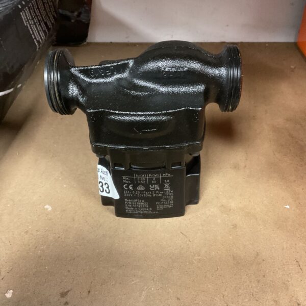 Black Grundfos UPS3 central heating pump with label visible.