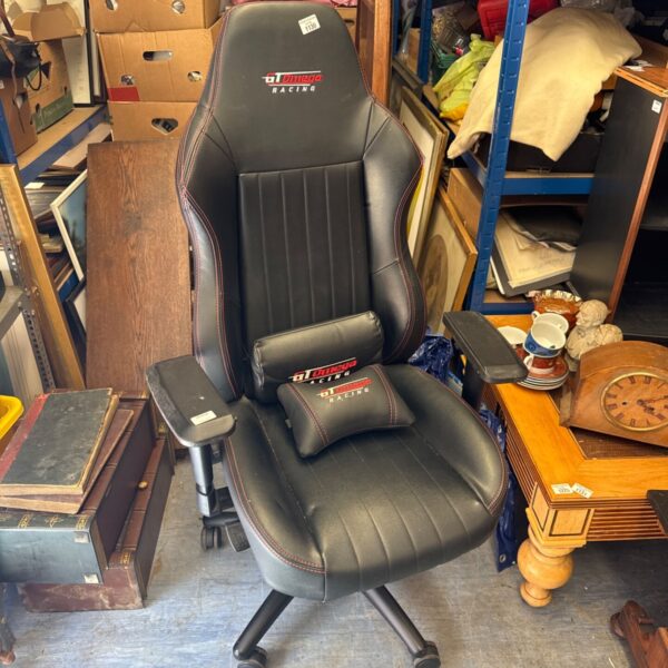 Black Gt omega gaming chair with adjustable features.