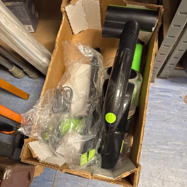 Gtech K9 cordless vacuum cleaner with charger and accessories.