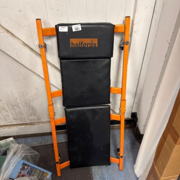 Halfords mechanics creeper board on a grey background.