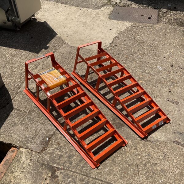 Orange car ramps for vehicle maintenance and repair.
