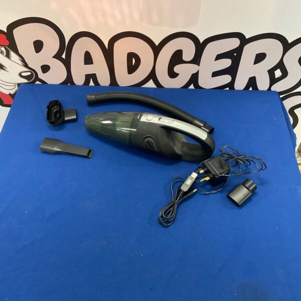 Used handheld vacuum cleaner with nozzle attachment for portable cleaning.