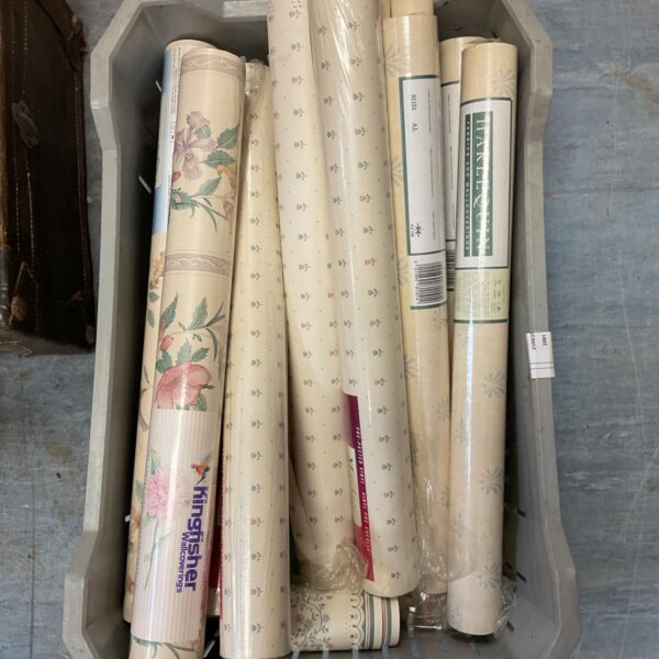 Box of vintage Harlequin and Kingfisher patterned wallpaper rolls.