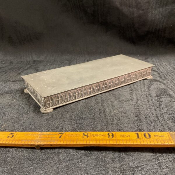 Vintage Haugrud pewter box with decorative pattern.