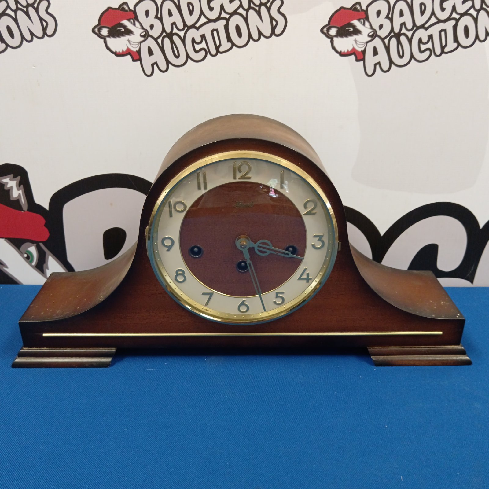 Vintage Hermle Napoleon mantle clock with wooden case.