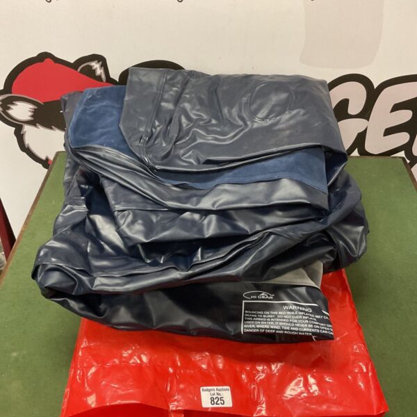 Two Hi Gear inflatable beds rolled up for storage.