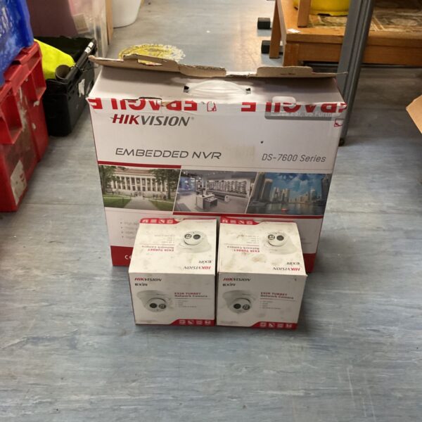 Hikvision security system box with NVR and EXIR turret cameras visible.