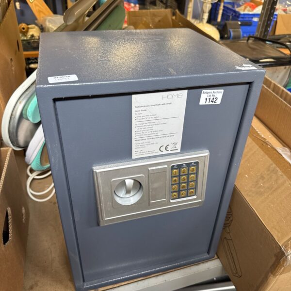 Front view of a steel home safe with a digital keypad.