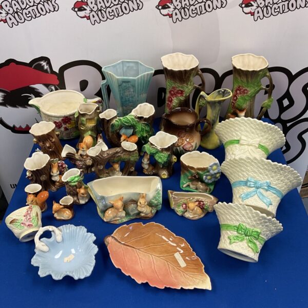 Vintage Hornsea pottery animal figurines and a Carltonware dish on display.