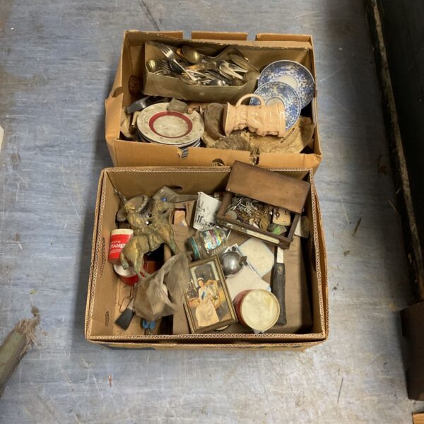 House clearance lot with vintage china and cutlery visible.