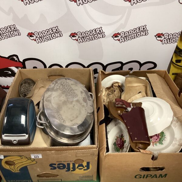 House clearance lot featuring decorative plates and vintage cutlery.