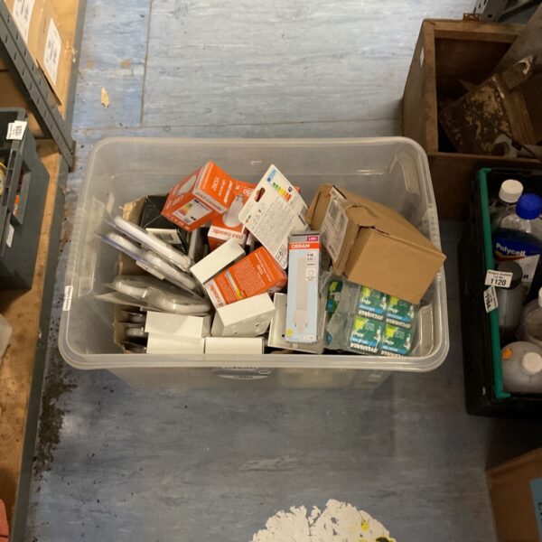 Box filled with various household essentials and light bulbs.