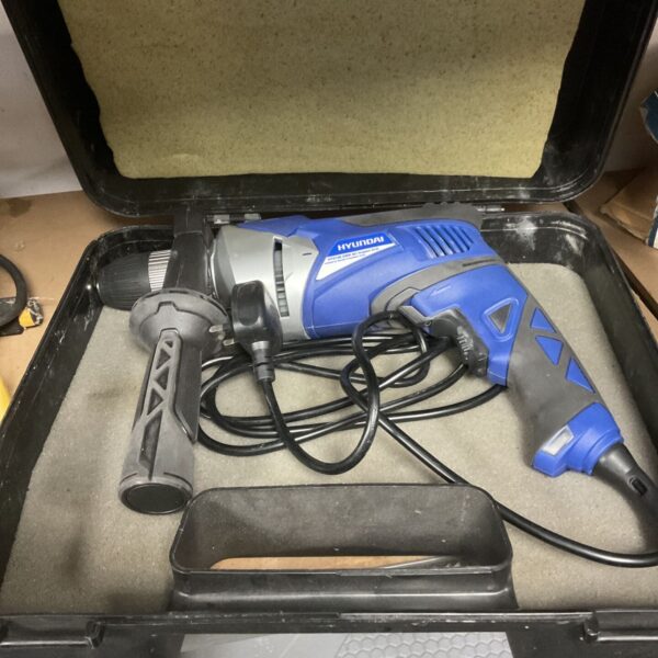 Hyundai HY2158 impact drill in a hard case, showing the tool's condition.