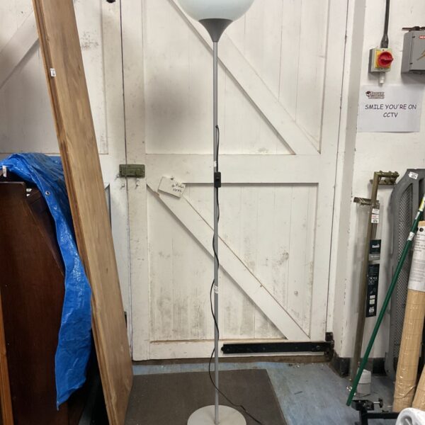 Silver Ikea floor standing lamp in a room setting.