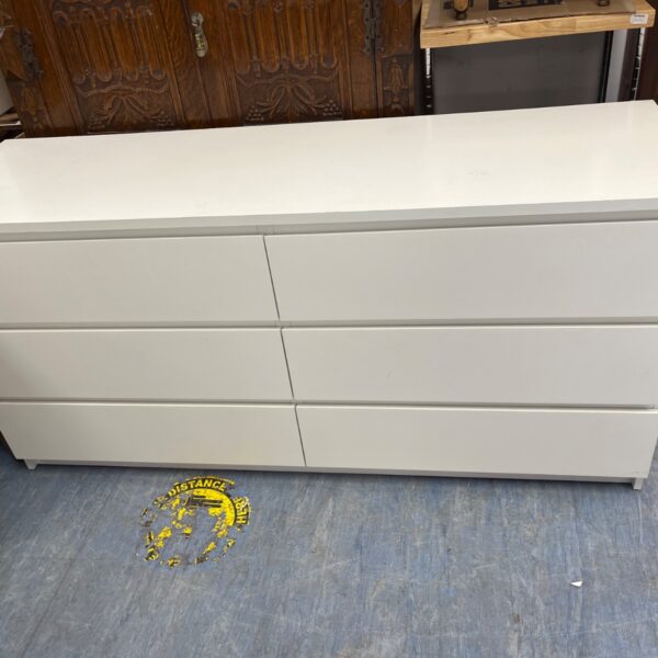 White IKEA MALM chest of drawers with six drawers for bedroom storage.