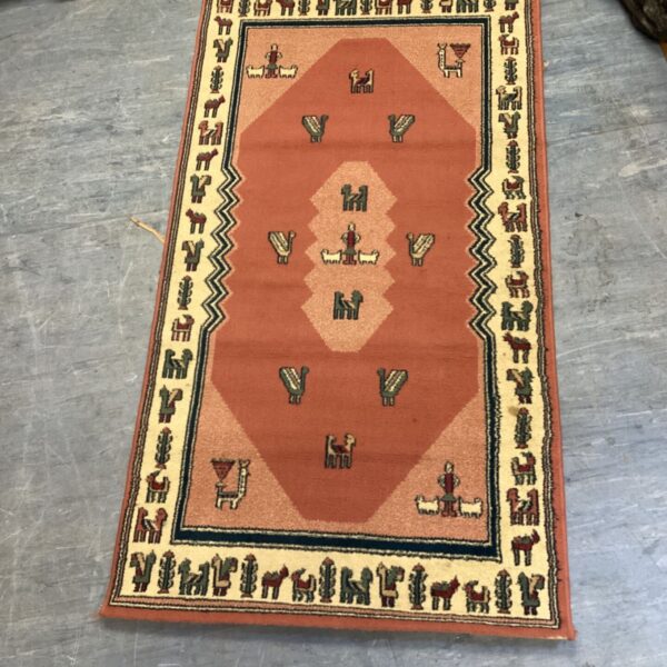 Gabbeh rug features a distinctive terracotta field adorned with stylized animal motifs and a geometric border