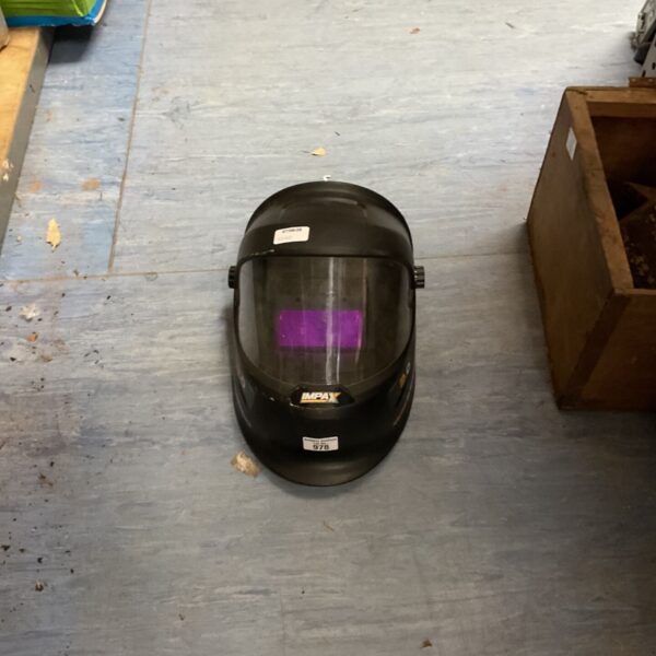 Used Impax automatic welding helmet for metalworking and welding safety.