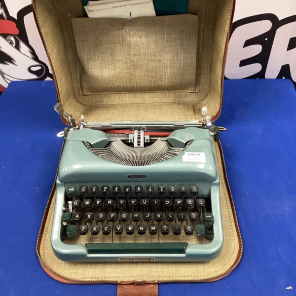 Vintage Imperial portable typewriter in a worn leather case.